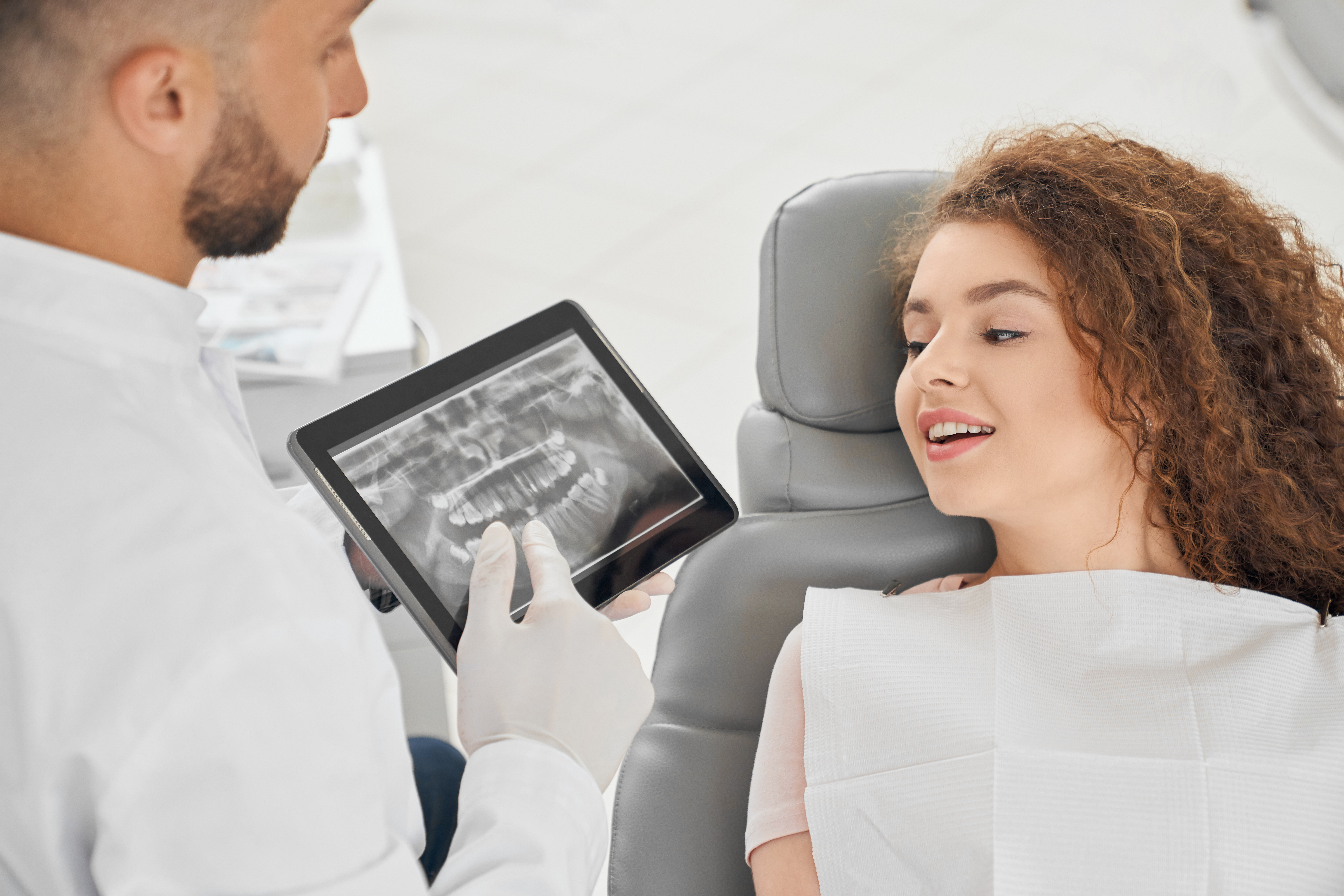 Orthodontist with dental x-rays for fast braces